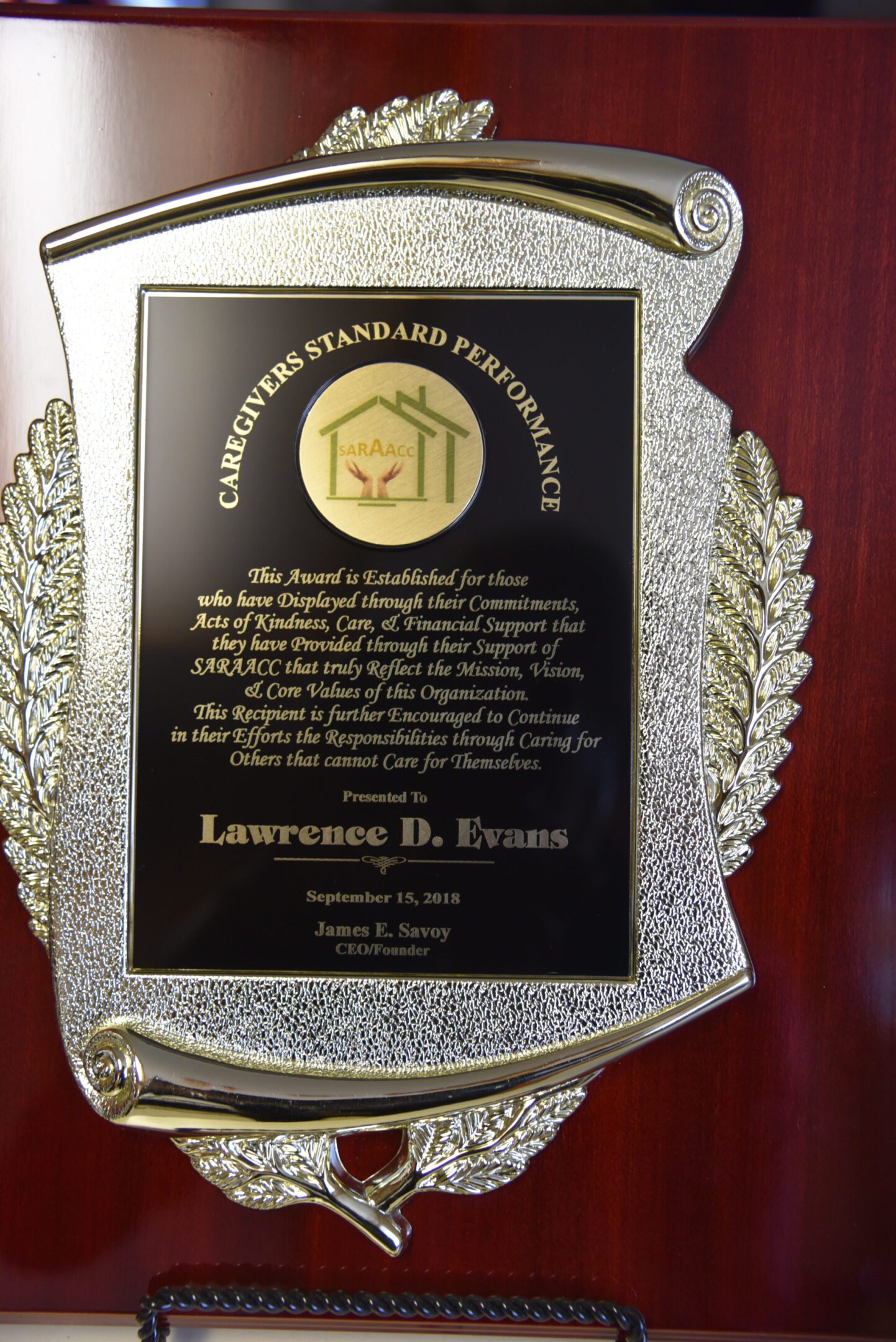 Award plaque with engraved text and design.