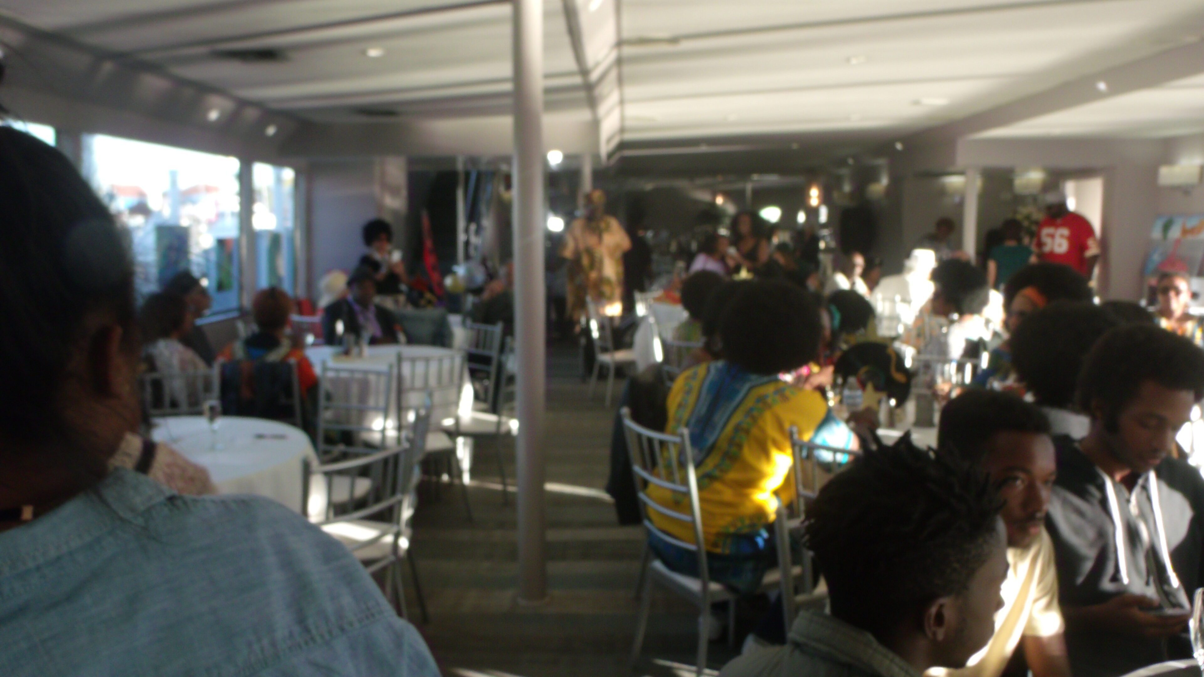 People dining in a busy restaurant setting.