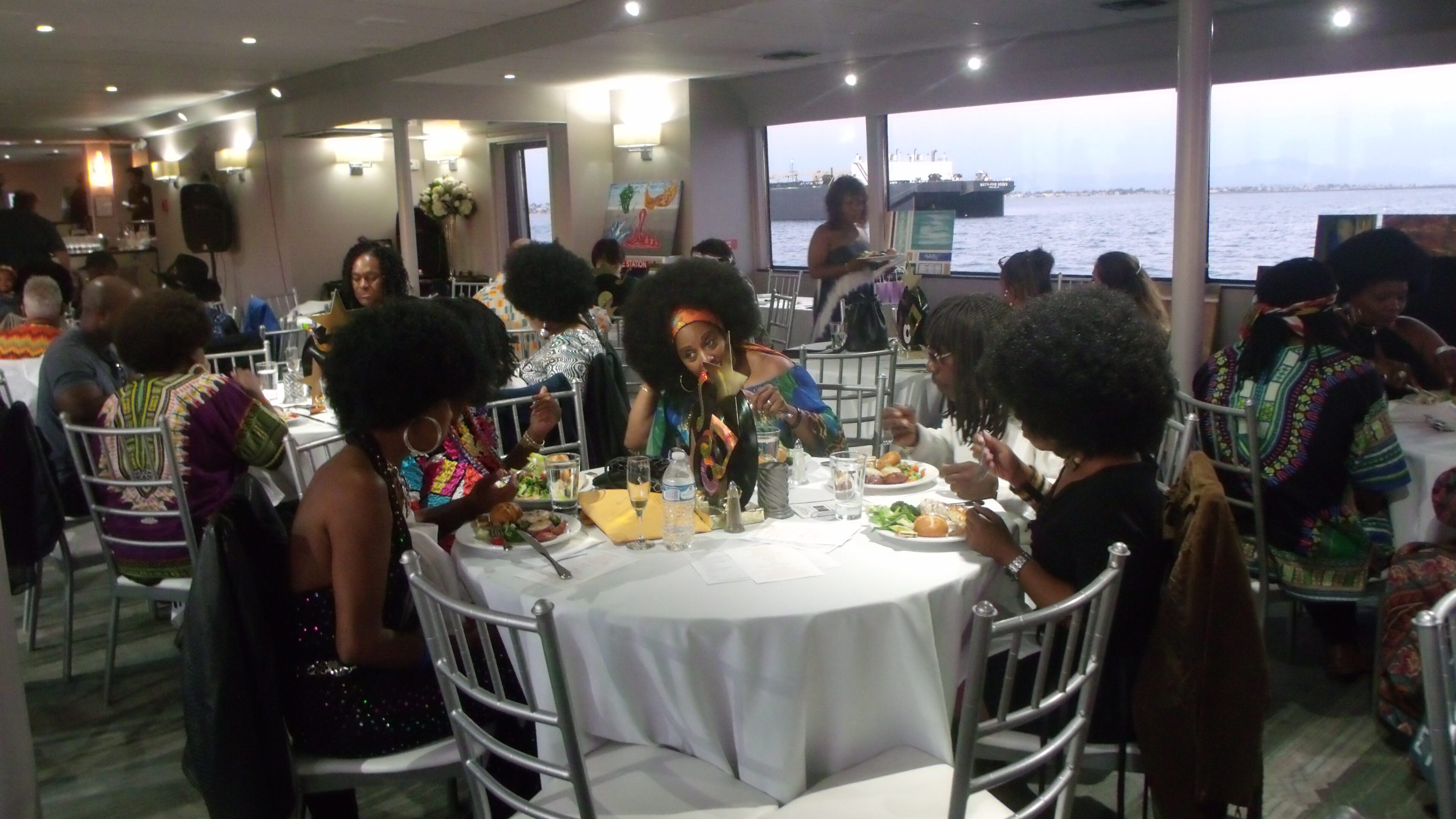 People dining at a formal event indoors.