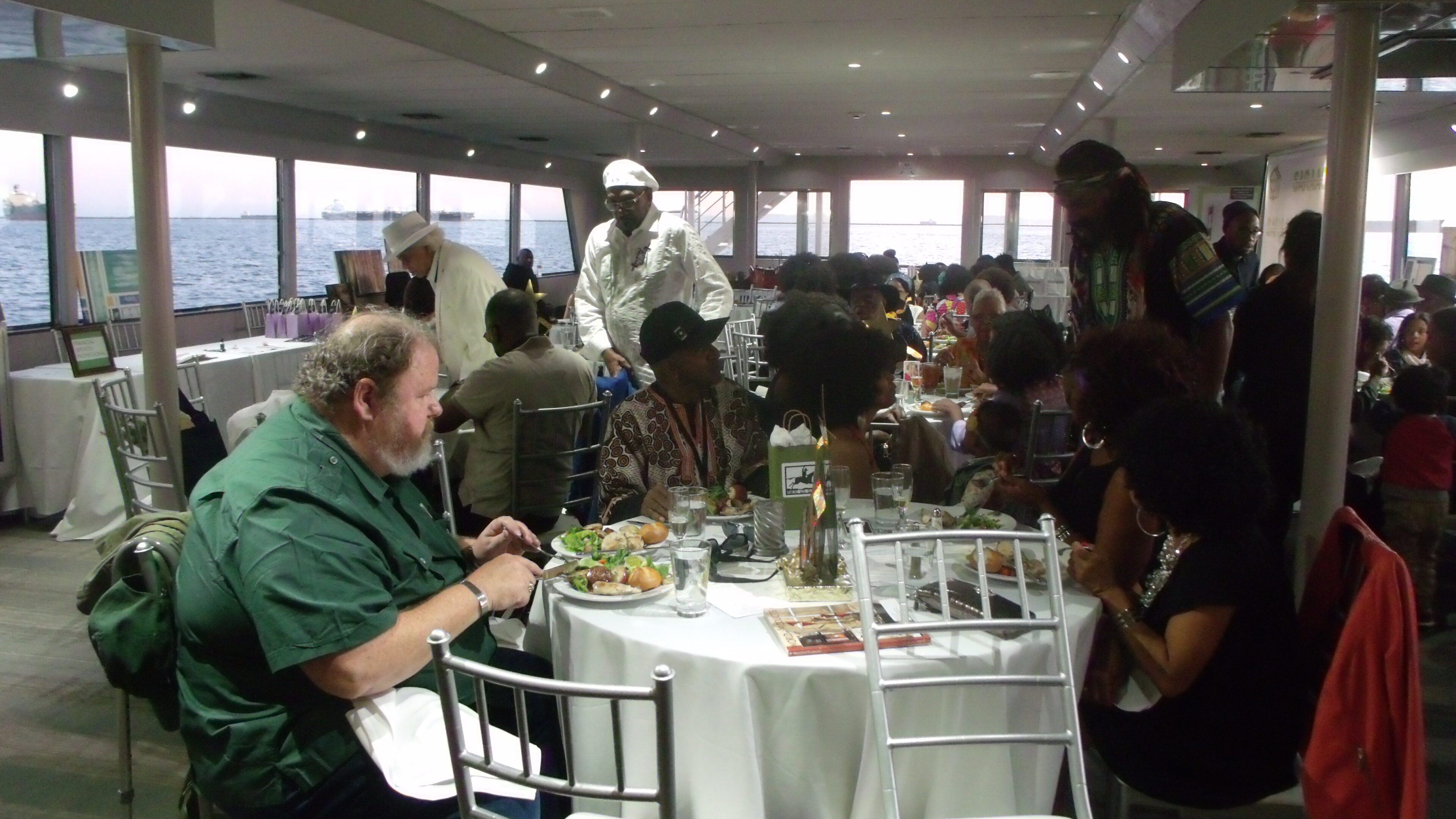 People dining together on a boat.