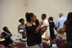 People socializing and eating at an event.