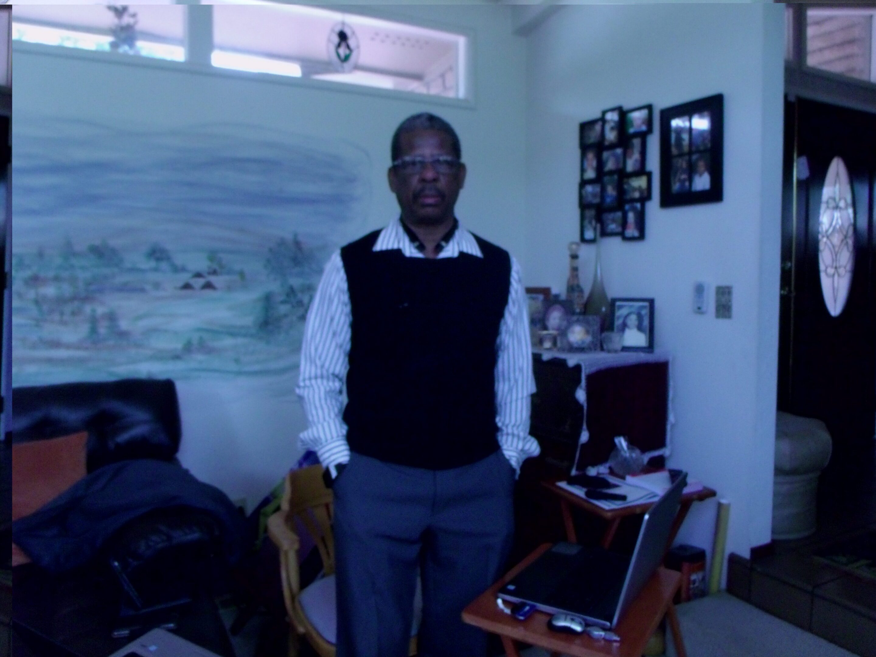 Man standing in a home office.