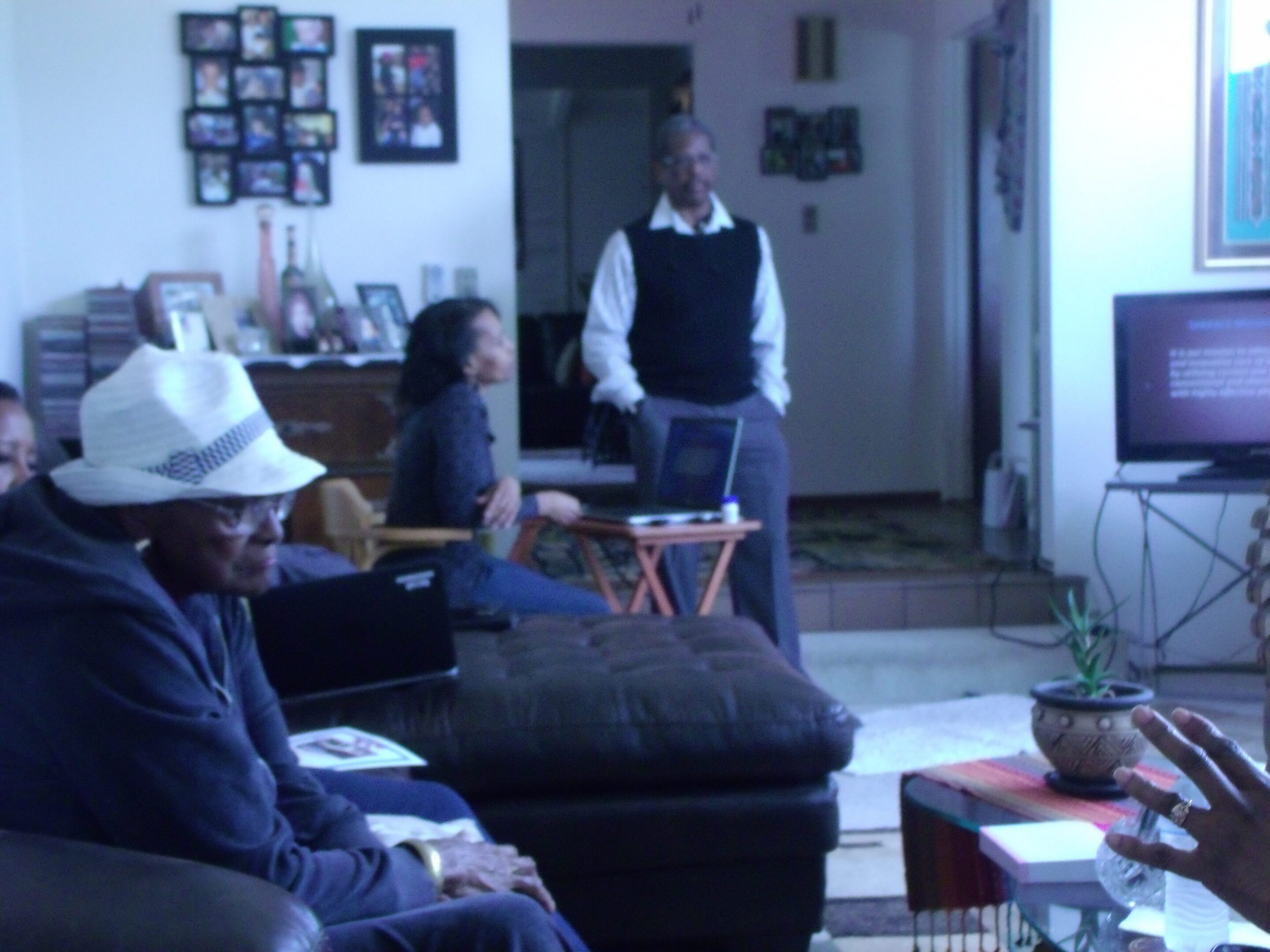 People gathered in a living room setting.