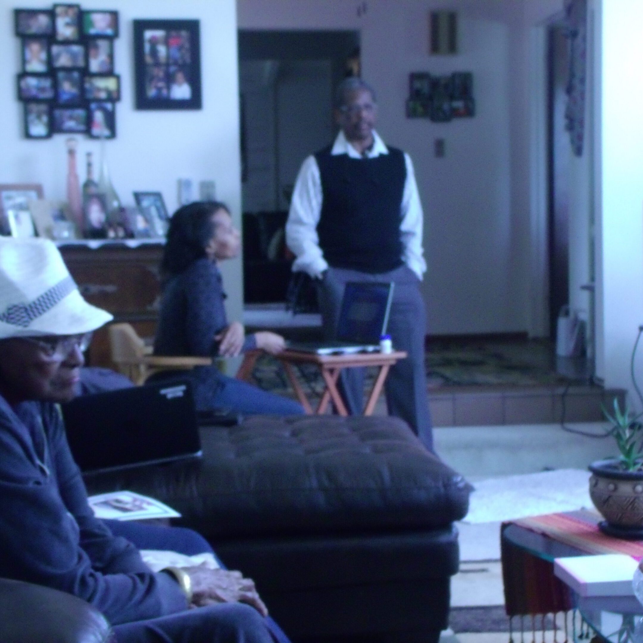 People gathered in a living room setting.